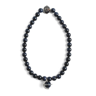 Dark blue beaded sandstone necklace with silver clasp on a white background